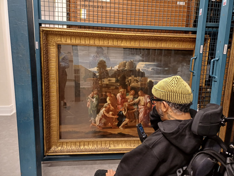 Christopher Samuel looking at the oil painting ‘The Healing of the Blind of Jericho’ by Nicolas Poussin from 1650 in the Birmingham Museum and Art Gallery stores.