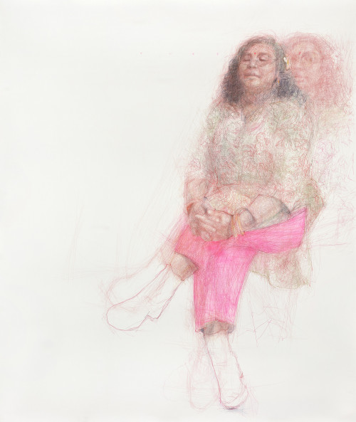 A delicate, layered pencil drawing of a person with long, curly hair sitting with their hands clasped on their lap. The person wears a floral-patterned top, bright pink trousers, and white shoes. Their face is calm, with eyes closed and a small red bindi on their forehead. A faint, ghostly duplicate of their figure appears in the background, creating a sense of movement or reflection. The artwork is rendered in soft, overlapping pencil strokes on a light background.