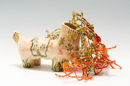 Palace toy horse with fishing net debris